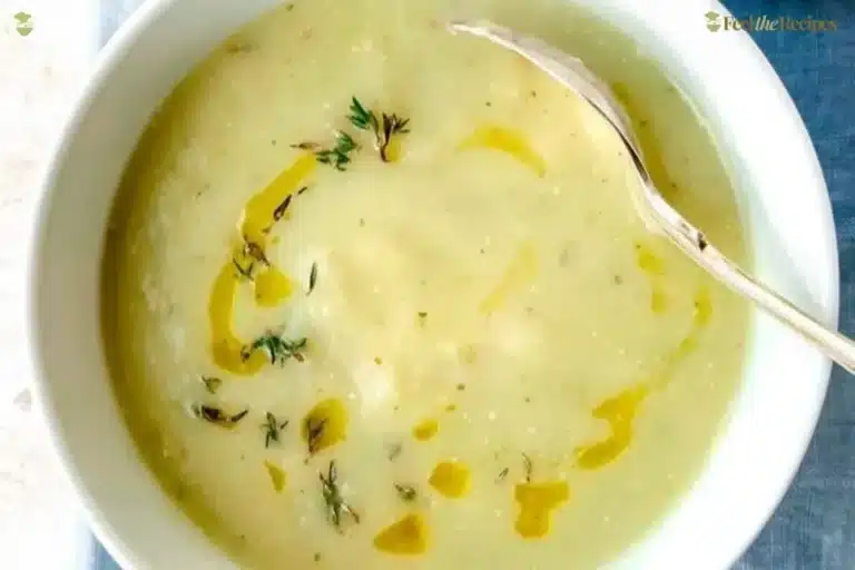 Delicious bowl of homemade celery leek soup garnished with herbs