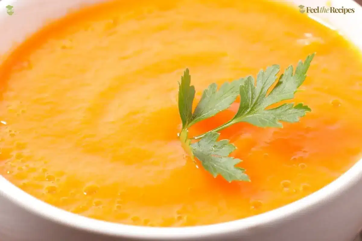 Gordon Ramsay carrot soup garnished with herbs and served in a bowl