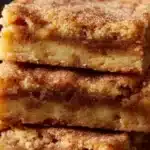 Delicious Apple Snickerdoodle Bars topped with cinnamon sugar.