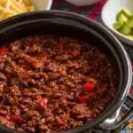 Delicious bowl of Chili with Bourbon, garnished and ready to serve.