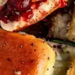 Cranberry turkey sliders served on a plate with garnish