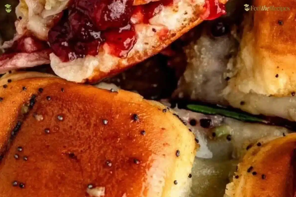 Cranberry turkey sliders served on a plate with garnish
