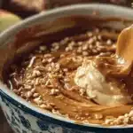 Cream cheese caramel apple dip served with sliced apples for dipping