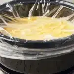 Delicious overnight slow cooker breakfast casserole served warm with herbs.