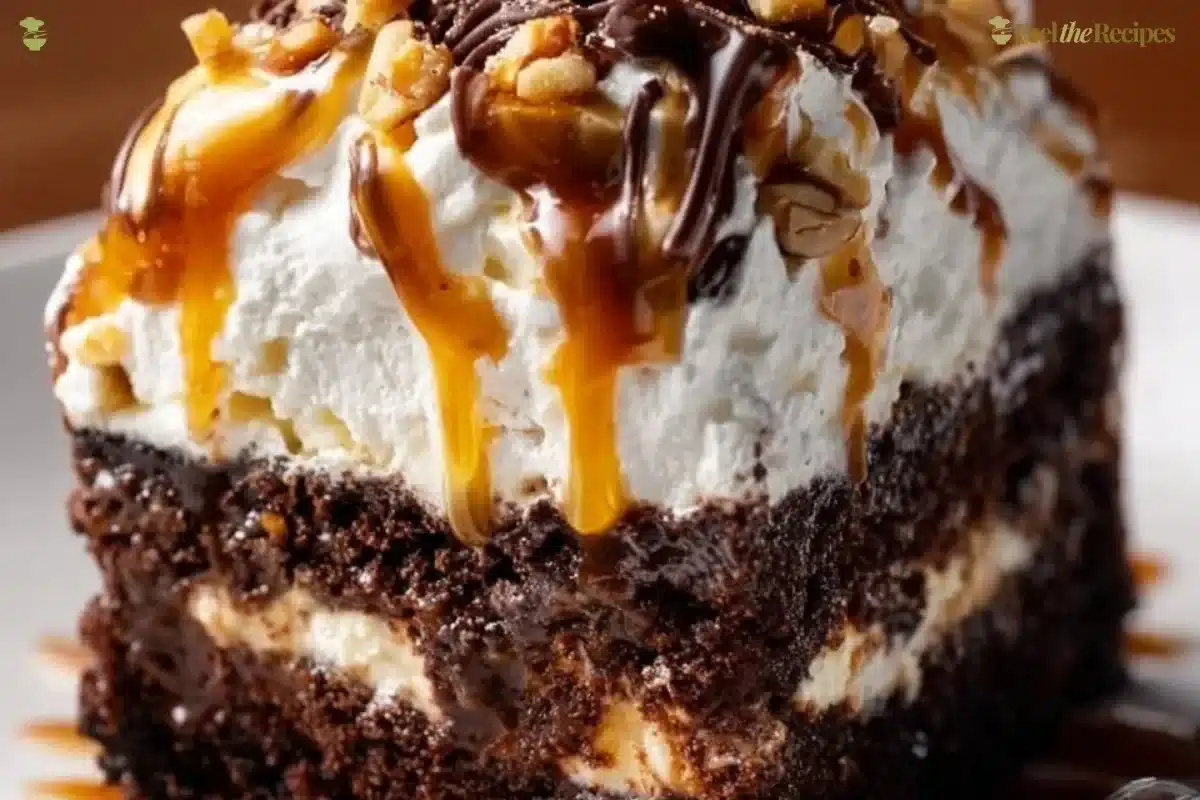 Delicious Better Than Sex Cake topped with creamy frosting and chocolate drizzle