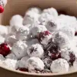 Delicious candied cranberries with Prosecco and orange juice on a plate