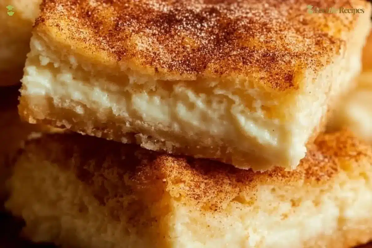 Delicious crescent cheesecake bars served on a white plate