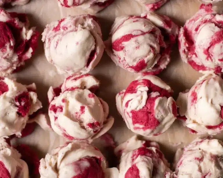Delicious raspberry chocolate chunk cookies with dark chocolate chunks and fresh raspberries