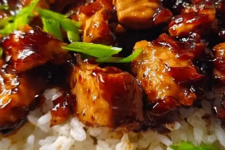Delicious Honey BBQ Chicken served over rice, garnished for flavor and presentation.