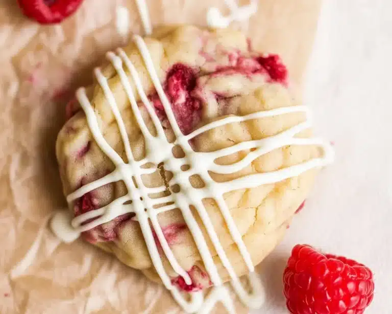 Delicious raspberry cookies displayed with creamy filling and vibrant colors.