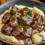 Tender beef tips in savory gravy served with mashed potatoes