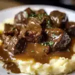 Delicious beef tips and gravy served with mashed potatoes