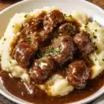 Delicious beef tips cooked in savory gravy served on a plate