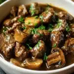 Creamy crockpot beef tips with mushrooms served on a plate