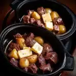 Crockpot Garlic Butter Beef Bites with Potatoes served in a bowl