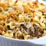 Delicious French onion beef casserole topped with melted cheese and onions