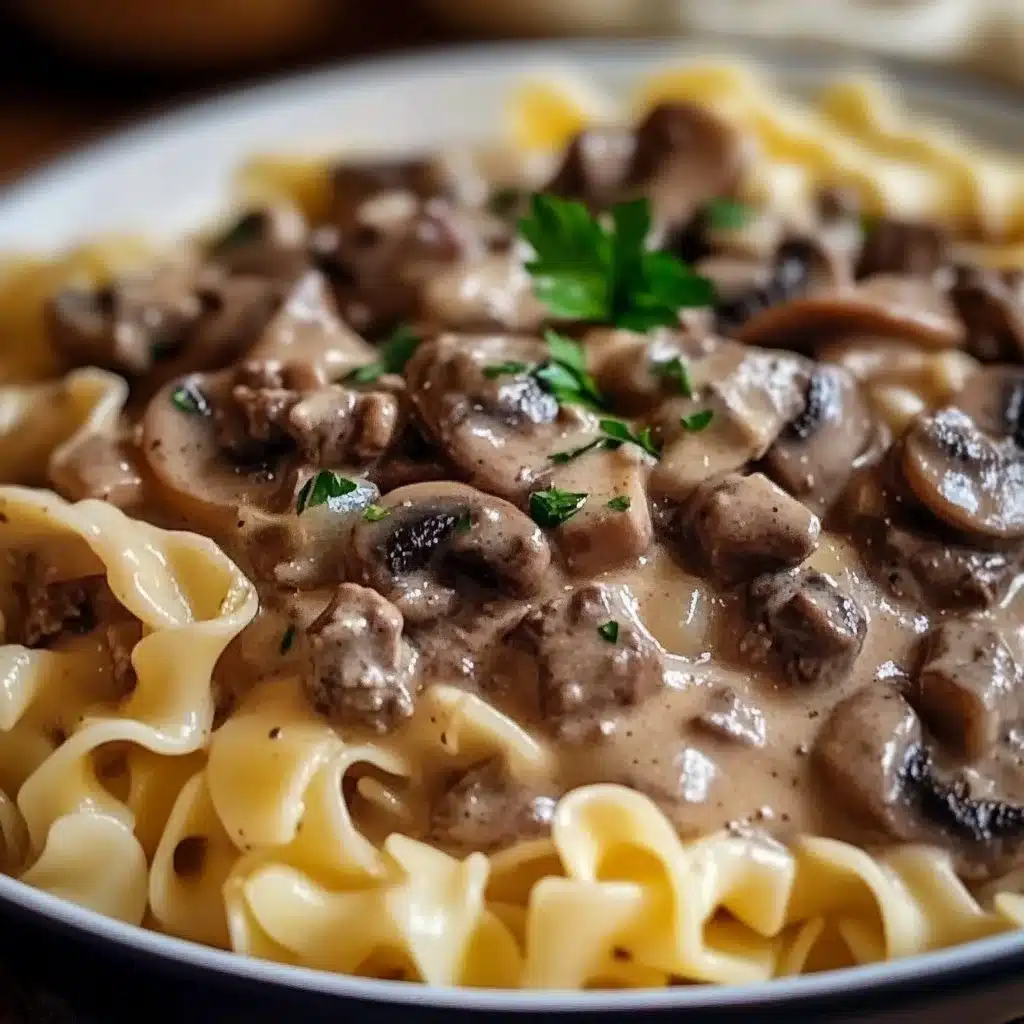 Delicious plate of Ground Beef Stroganoff garnished with parsley.