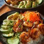 Shrimp rice bowls with spicy mayo, garnished with green onions and sesame seeds.