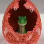 Child conducting a Dinosaur Egg Fizzing experiment with colorful fizzy eggs.