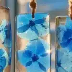 DIY Blue Crayon Suncatchers shining in sunlight
