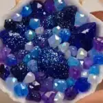 DIY crystal seashells adorned with glitter, transforming simple shells into sparkling decor.