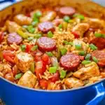 A colorful bowl of easy one pot jambalaya filled with shrimp, sausage, and rice.