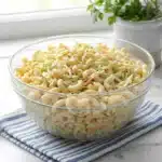 Creamy pasta salad with coleslaw dressing served in a bowl