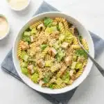 Bowl of Easy Creamy Chicken Caesar Pasta Salad with grilled chicken and dressing
