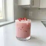 Healthy pink drink recipe with fresh fruits and ingredients
