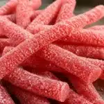 Homemade Rhubarb Sour Belts on a wooden table
