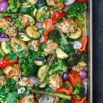 Sheet pan chicken and veggies arranged for an easy and delicious one-pan dinner