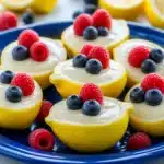 A delicious lemon posset dessert garnished with fresh mint leaves.