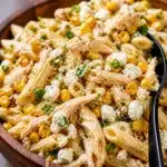 Colorful corn pasta salad with grilled corn, herbs, and creamy dressing.