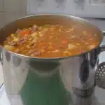 Bowl of easy slow cooker hamburger vegetable soup filled with colorful vegetables.