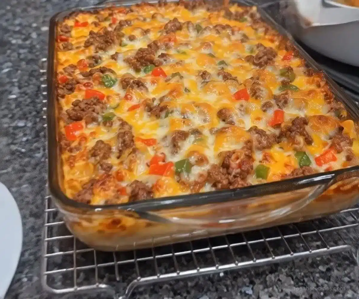 Skillet Ground Beef Casserole with Peppers and Onions in a baking dish.